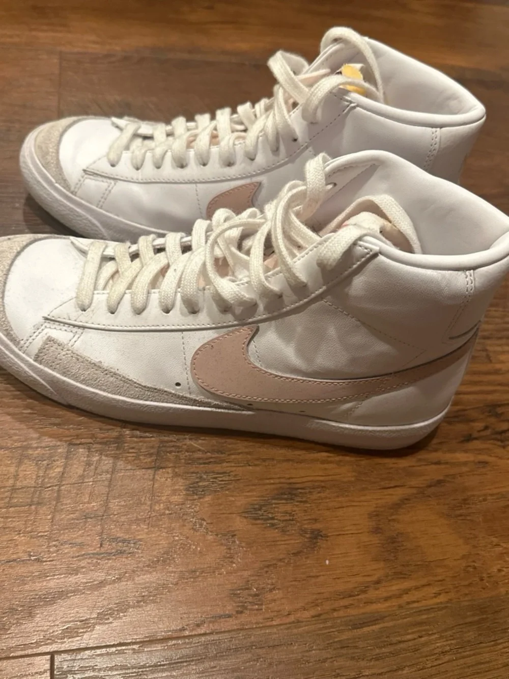 Nike Women's White High-Top Sneakers with Pink Swoosh Accent